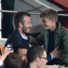 David Beckham avec ses fils Cruz, Romeo et Brooklyn lors de la 35e journée du championnat de France de football, au Parc des Princes, entre le PSG et Valenciennes (1-1) à Paris le 5 mai 2013. Le joueur du PSG a passé un bon moment avec ses fils.