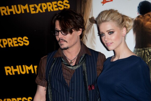 Johnny Depp et Amber Heard à la première de Rhum Express à Paris au Gaumont Marignan, Paris, le 8 novembre 2011.