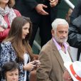 Jean-Paul Belmondo et sa petite fille Annabelle assistent au 8e sacre de Rafael Nadal lors des Internationaux de France à Roland Garros à Paris le 9 juin 2013.