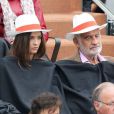 Jean-Paul Belmondo et sa petite fille Annabelle assistent au 8e sacre de Rafael Nadal lors des Internationaux de France à Roland Garros à Paris le 9 juin 2013.