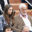 Jean-Paul Belmondo et sa jolie petite fille Annabelle assistent au 8e sacre de Rafael Nadal lors des Internationaux de France à Roland Garros à Paris le 9 juin 2013.