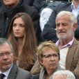 L'acteur Jean-Paul Belmondo et sa petite fille Annabelle assistent au 8e sacre de Rafael Nadal lors des Internationaux de France à Roland Garros à Paris le 9 juin 2013.