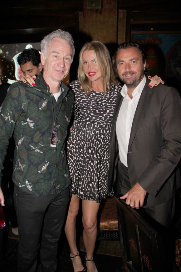 John McEnroe, Henri Leconte et sa femme Florentine lors du dîner du Trophée des Légendes au Buddha-Bar à Paris le 5 juin 2013