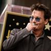 Johnny Depp lors de la remise de l'étoile de Jerry Bruckheimer sur Hollywood Boulevard à Los Angeles le 24 juin 2013