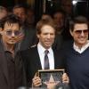 Jerry Bruckheimer, Johnny Depp, Tom Cruise lors de la remise de l'étoile de Jerry Bruckheimer sur Hollywood Boulevard à Los Angeles le 24 juin 2013