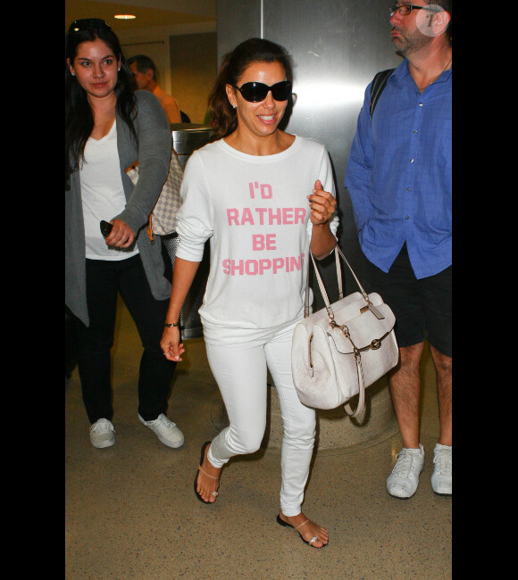 Eva Longoria, au naturel, arrive à l'aéroport international de Los Angeles le 16 août 2013