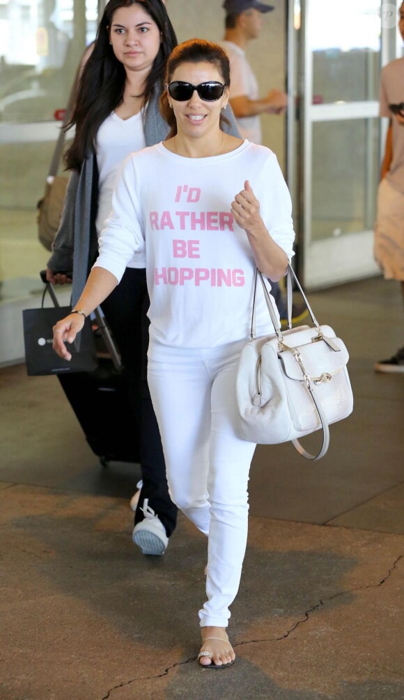 Eva Longoria, au naturel, arrive à l'aéroport international de Los Angeles le 16 août 2013
