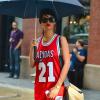 Rihanna, stylée sous la pluie, porte des lunettes Le Specs, une robe adidas originals by Jeremy Scott et des baskets Air Jordan. New York, le 2 septembre 2013.