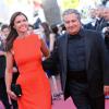 Isabelle de Araujo et Christian Clavier lors de la montée des marches du film "The Immigrant" lors du 66eme festival du film de Cannes le 24 mai 2013