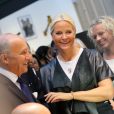 La princesse Mette-Marit de Norvège avec le ministre des Affaires Etrangères Laurent Fabius au Grand Palais à Paris le 11 septembre 2013 pour l'inauguration de la biennale d'arts créatifs, Révélations.