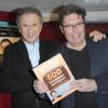Michel Drucker et Gilles Verlant lors de la présentation de leur livre 'Les 500 emissions mythiques de la television Francaise' à Paris le 1er décembre 2012
