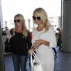 Pamela Anderson arrive à l'aéroport de Los Angeles le 23 septembre 2013.