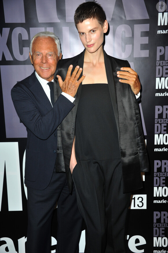 Giorgio Armani et Saskia de Brauw au Prix d'excellence de la mode 2013 du magazine Marie Claire au Palais de Tokyo à Paris le 2 octobre 2013.