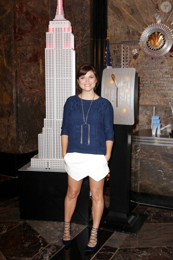 Tiffani Thiessen à l'Empire State Building pour présenter la campagne Jumpstart's Read for the Record à New York, le 2 octobre 2013.