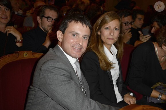 Manuel Valls et sa femme Anne Gravoin à Paris, le 16 septembre 2013