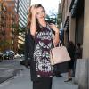 Miranda Kerr se rend dans un building pour une réunion avec le magazine Cosmopolitan à New York, le 15 octobre 2013.