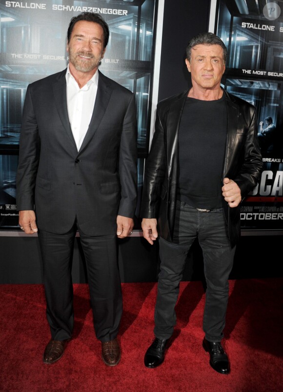 Arnold Schwarzenegger et Sylvester Stallone à la première du film Evasion (The Escape Plan) à New York le 15 octobre 2013.