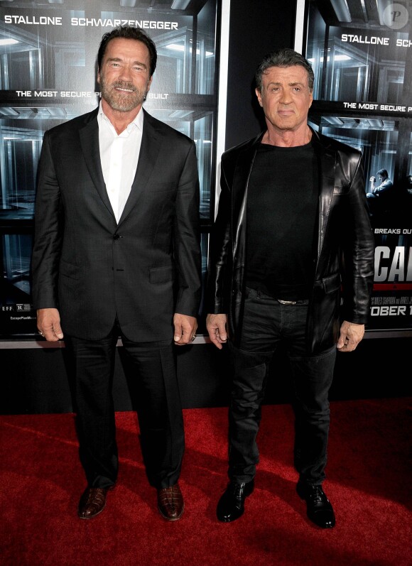 Arnold Schwarzenegger et Sylvester Stallone à la première du film Evasion (The Escape Plan) à New York le 15 octobre 2013.