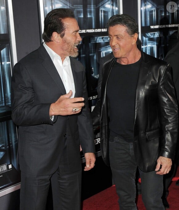 Arnold Schwarzenegger, Sylvester Stallone à la première du film Evasion (The Escape Plan) à New York le 15 octobre 2013.