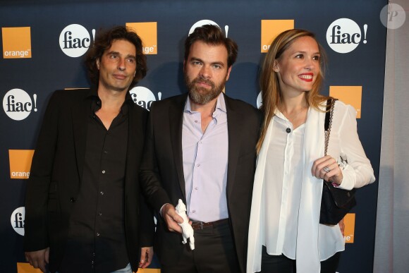 Richard Orlinski, Clovis Cornillac et sa femme Lilou Fogli lors de la soirée d'inauguration de la FIAC au Grand Palais à Paris le 23 octobre 2013