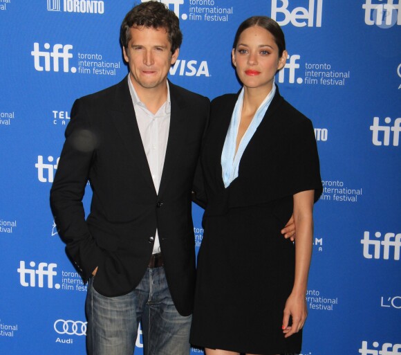 Marion Cotillard (habillée en Dior Haute Couture) et Guillaume Canet à Toronto, le 10 septembre 2013.