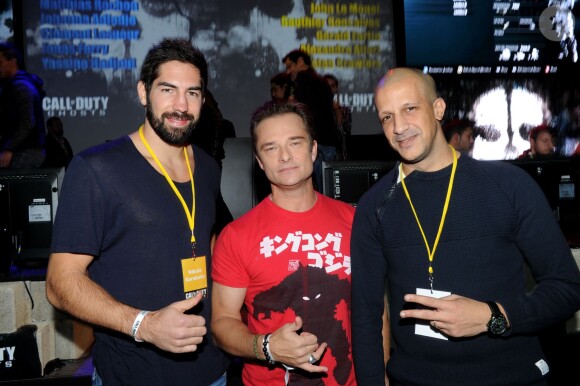 Nikola Karabatic, David Hallyday et Rim'K lors de la soirée de lancement de Call of Duty : Ghosts (disponible le 5 novembre 2013) le 4 novembre 2013 au Yoyo, au Palais de Tokyo, à Paris.