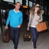Exclusif - Liz Hurley et Shane Warne arrivent à l'aéroport de Londres. Le couple semble heureux, malgré les rumeurs, de quitter la grisaille londonienne ensemble. Le 6 novembre 2013.