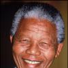 Nelson Mandela, souriant lors d'une visite au Royaume-Uni en 1993. Le leader sud-africain est mort le 5 décembre 2013.