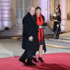 Jean-Yves Le Drian ministre de la Défense et sa femme lors du dîner du Sommet pour la paix et la sécurité en Afrique au palais de l'Elysée à Paris le 6 décembre 2013