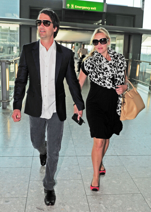 Kate Winslett et Ned Rocknroll à l'aéroport de Heathrow à Londres le 5 septembre 2013
