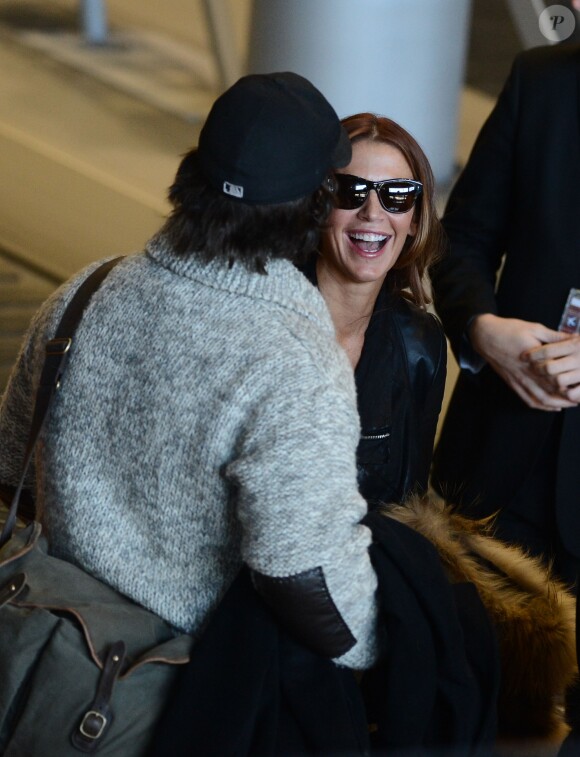 Poppy Montgomery et son chéri Shawn Sanford arrivent à l'aéroport Roissy Charles de Gaulle. Roissy, le 9 décembre 2013.