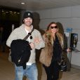 Poppy Montgomery et son chéri Shawn Sanford arrivent à l'aéroport Roissy Charles de Gaulle. Roissy, le 9 décembre 2013.
