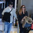 Poppy Montgomery et son chéri Shawn Sanford arrivent à l'aéroport Roissy Charles de Gaulle. Roissy, le 9 décembre 2013.