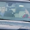 Le prince William, Kate Middleton, duchesse de Cambridge, et leur fils le prince George de Cambridge à Buckingham Palace le 18 décembre 2013 pour le déjeuner de Noël en famille offert par la reine Elizabeth II