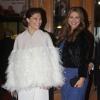La princesse Victoria et la princesse Madeleine, enceinte, au Théâtre Oscar à Stockholm le 19 décembre 2013 pour la soirée spéciale en l'honneur des 70 ans de la reine Silvia de Suède.