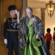 La reine Margrethe II de Danemark et le prince consort Henrik au palais Christian VII d'Amalienborg, à Copenhague, le 1er janvier 2014 pour le banquet du Nouvel An offert par la monarque.