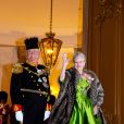 La reine Margrethe II de Danemark et le prince consort Henrik au palais Christian VII d'Amalienborg, à Copenhague, le 1er janvier 2014 pour le banquet du Nouvel An offert par la monarque.