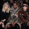 Noomi Rapace, Kanye West et Carine Roitfeld assistent au défilé Givenchy automne-hiver 2014-2015, à la Halle Freyssinet. Paris, le 17 janvier 2014.