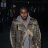 Kanye West arrive à la Halle Freyssinet pour le défilé Givenchy automne-hiver 2014-2015. Paris, le 17 janvier 2014.