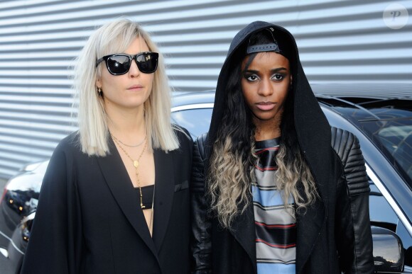 Noomi Rapace et Angel Haze à la Halle Freyssinet lors du défilé Givenchy automne-hiver 2014-2015. Paris, le 17 janvier 2014.