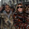 Kanye West et Carine Roitfeld assistent au défilé Givenchy automne-hiver 2014-2015, à la Halle Freyssinet. Paris, le 17 janvier 2014.