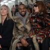 Noomi Rapace, Kanye West et Carine Roitfeld assistent au défilé Givenchy automne-hiver 2014-2015, à la Halle Freyssinet. Paris, le 17 janvier 2014.
