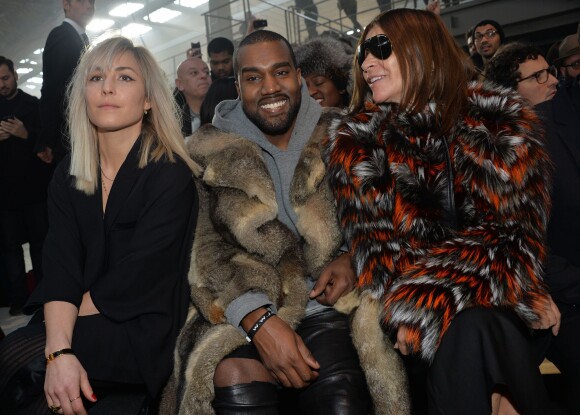 Noomi Rapace, Kanye West et Carine Roitfeld assistent au défilé Givenchy automne-hiver 2014-2015, à la Halle Freyssinet. Paris, le 17 janvier 2014.