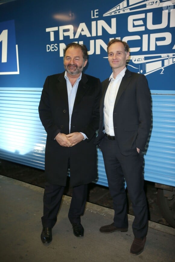 Denis Olivennes et Fabien Namias lors de l'inauguration du "Train Europe 1" pour les municipales 2014 à Paris le 2 février 2014