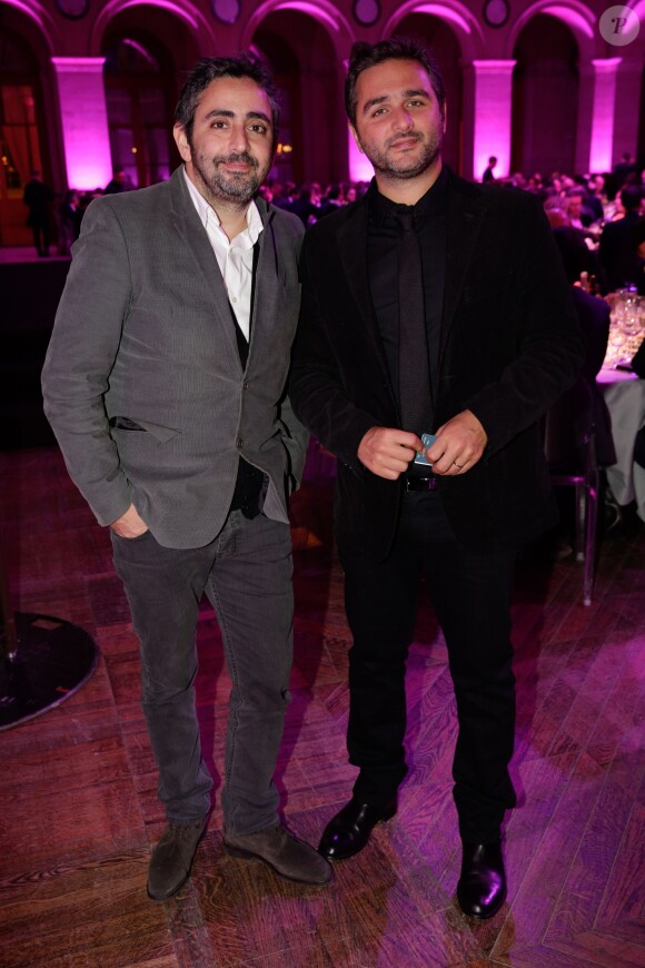Eric Toledano et Olivier Nakache lors de la 21e cérémonie des trophées du "Film Français" au palais Brongniart à Paris le 4 février 2014