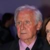 Michel Hidalgo fête ses 80 ans avec une amie lors d'une soirée au Palais Maillot à Paris le 25 mars 2013