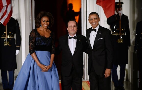 Barack Obama et Lady Michelle Obama avec le président François Hollande lors du dîner d'Etat organisé à la Maison Blanche à Washington, le 11 février 2014.