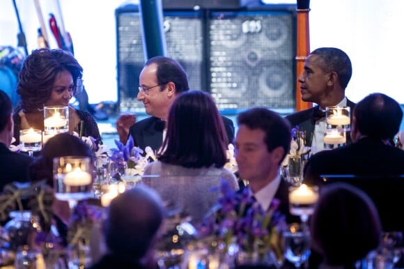 Lady Michelle Obama, François Hollande et Barack Obama lors du dîner d'Etat organisé à la Maison Blanche à Washington, le 11 février 2014.