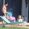 Joanna Krupa profite avec son mari Romain Zago du soleil dans le jardin de sa propriété de Miami, et nous gratifie de ses charmes en bikini, le 19 février 2014
