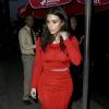 Kim Kardashian arrive au restaurant Crustacean à Beverly Hills, habillée d'un ensemble rouge Calvin Klein Collection et de sandales Tom Ford. Le 19 mars 2014.